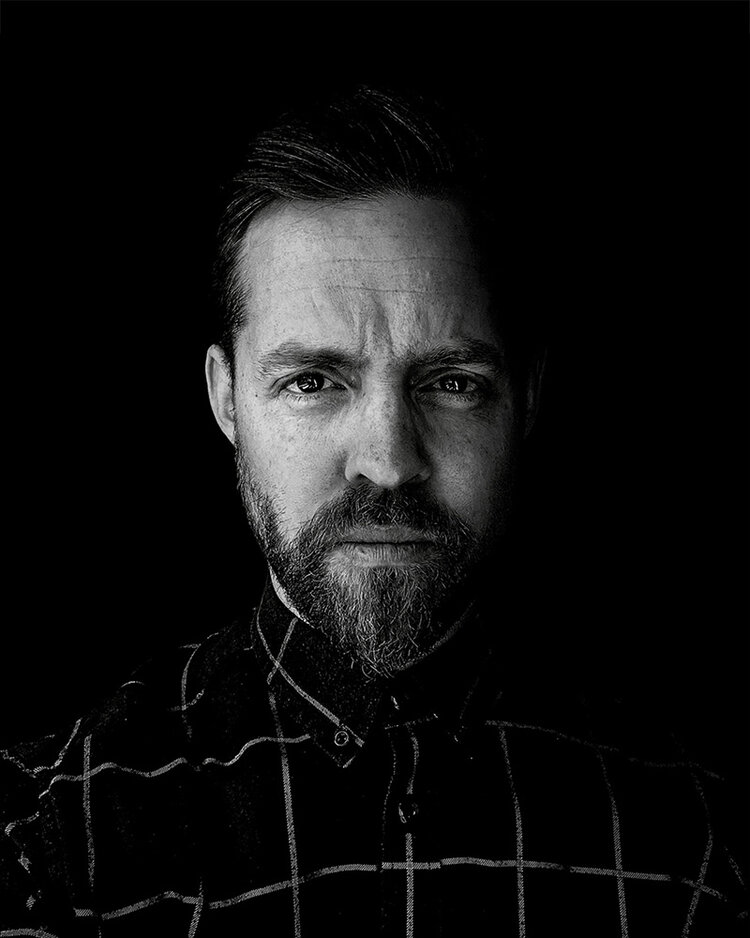 A profile picture of Luke Preece in black-and-white